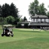 A view of a green and the clubhouse at Elms Country Club.