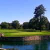 A view of a green surrounded by water at Westfield Country Club.