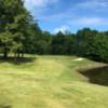 A sunny day view of a hole at Punderson State Park Golf Course.