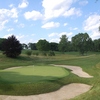 A view of the par-3 5th green surrounded by bunkers at Moraine Country Club