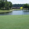 A view of the clubhouse with green in foreground at Ravenswood Golf Club