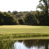 A view over the water of green at White Oak Golf Course