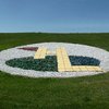 A view of Hidden Lake Golf Course sign on grass