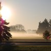 A sunny view of hole #16 from the fieldhouse at Forrest Creason Golf Course