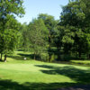 A sunny view of green with water coming into play at Kings Mill Golf Club