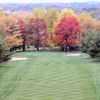 A view of a fairway guarded by colorfull fall trees at Paradise Lake Country Club