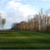 A view of a fairway with narrow cart path on the left side at Safari Golf Club