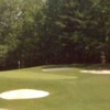 A view of a green protected by sand traps at Elm Golf Course