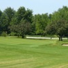 A view of a green guarded by a bunker at Shelby Crossing Golf Course.