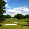 A view of a fairway and a green protected by sand traps at Kyber Run Golf Course