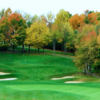 A view of a green protected by a collection of bunkers at Deer Ridge Golf Club