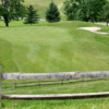 A view of a green flanked by sand traps at Fire Ridge Golf Course