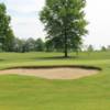 A view of a hole guarded by a bunker at Raintree Country Club