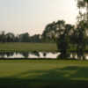 A view of a green with water coming into play at Rolling Acres Golf Course