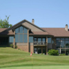 A view of a hole and the clubhouse at Rosemont Country Club