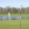 A view of the 14th hole at Bent Tree Golf Club surrounded by water