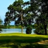 A view of a hole with water in background at Congress Lake Club