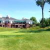 A view of a green and the clubhouse at Findlay Country Club