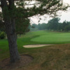 A view of a green protected by sand traps at Shawnee Country Club