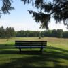 A sunny day view of a tee at Pine Meadows Golf Course