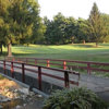 View of a bridge and green at Ashland Golf Club