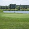 A view of the 9th green with water in background at Royal American Links Golf Club