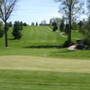 A view of hole #10 with cart path on the right and clubhouse in background at Saint Albans Golf Club green from tee box at Saint Albans Golf Club