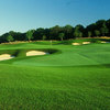 A view of green #15 protected by bunkers at Tartan Fields Golf Club