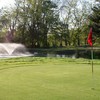 A view of green with water fountain in background at Big Walnut Golf Club