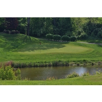 The 176-yard fourth hole at Deer Run Country Club drops to a green behind a pond. 